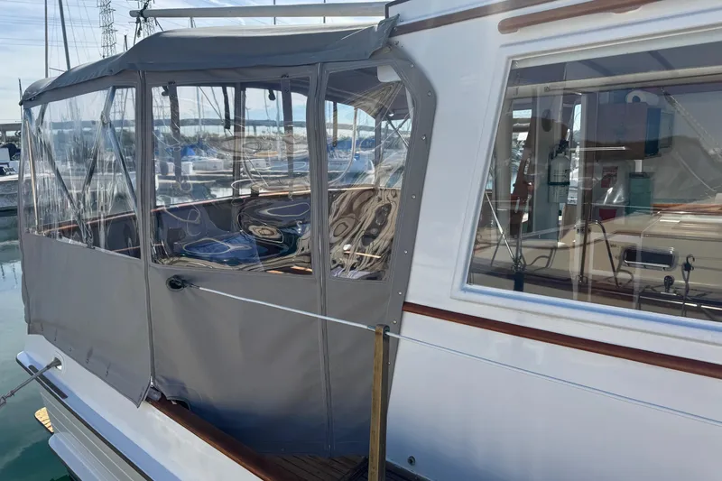 Slide: The Image of 1966 Grand Banks 32 Sedan with enclosed cockpit at marina. - 6