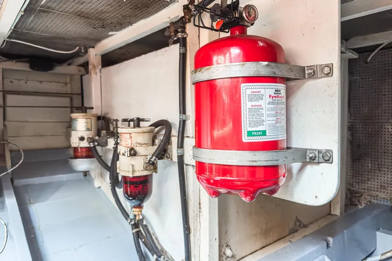 Slide: The Image of Engine room of 1966 Grand Banks 32 Sedan with fire suppression system. - 60