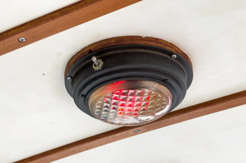 Slide: The Image of Vintage ceiling light fixture on 1966 Grand Banks 32 Sedan boat interior. - 61