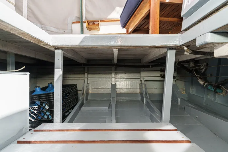 Slide: The Image of Interior view of 1966 Grand Banks 32 Sedan boat, showcasing storage and seating area. - 64