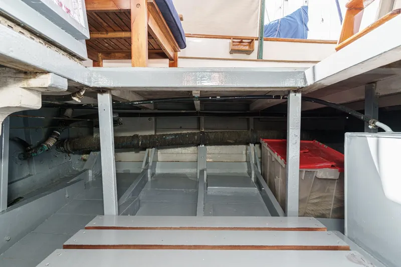 Slide: The Image of Interior view of a 1966 Grand Banks 32 Sedan boat, showcasing storage and seating area. - 71