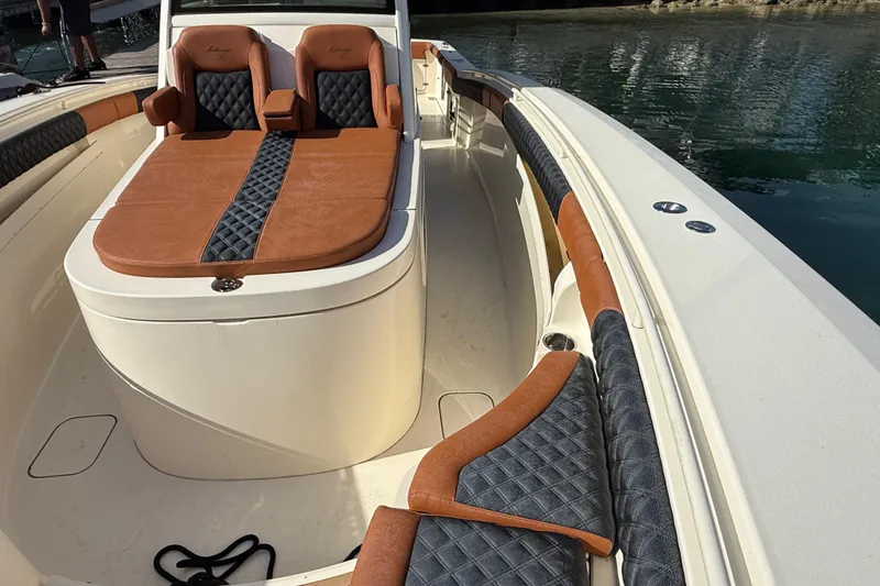 Slide: The Image of 2019 Scout 355 LXF boat interior with luxurious leather seating and elegant design. - 19