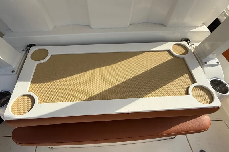 Slide: The Image of Scout 355 LXF 2019 boat table with cup holders. - 21