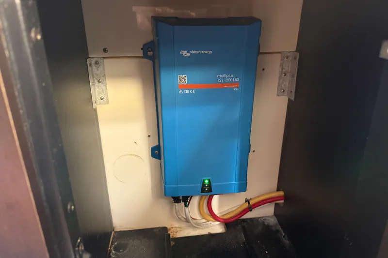 Slide: The Image of Blue Victron Energy MultiPlus inverter in a 2019 Scout 355 LXF boat compartment. - 45