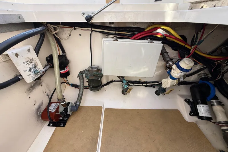 Slide: The Image of Engine compartment of 2019 Scout 355 LXF boat with wiring and components visible. - 51