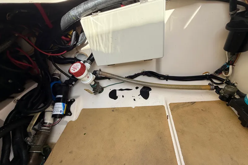 Slide: The Image of 2019 Scout 355 LXF boat interior wiring and plumbing components. - 52