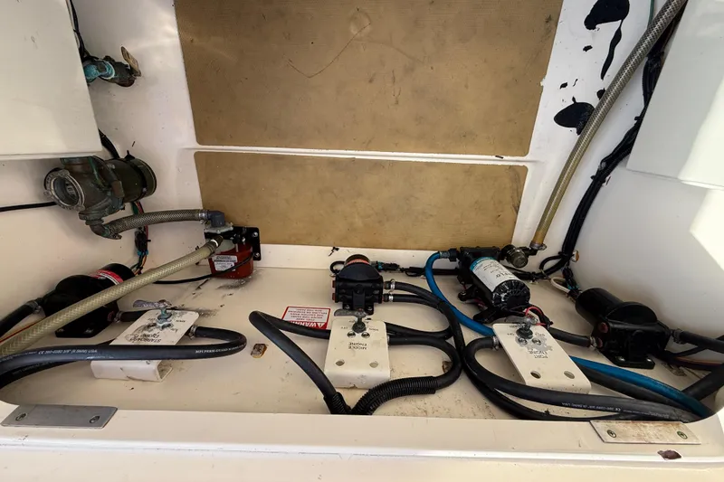 Slide: The Image of 2019 Scout 355 LXF boat interior showing mechanical components and wiring. - 53