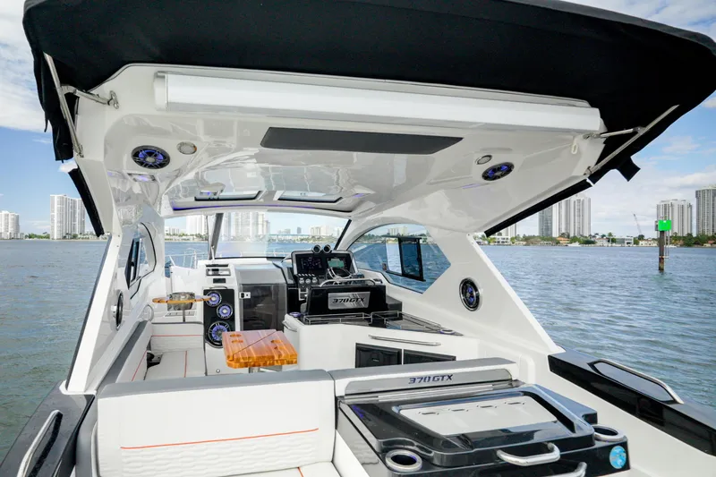Slide: The Image of Interior view of 2026 Granfort 37 boat with modern design and city skyline backdrop. - 19