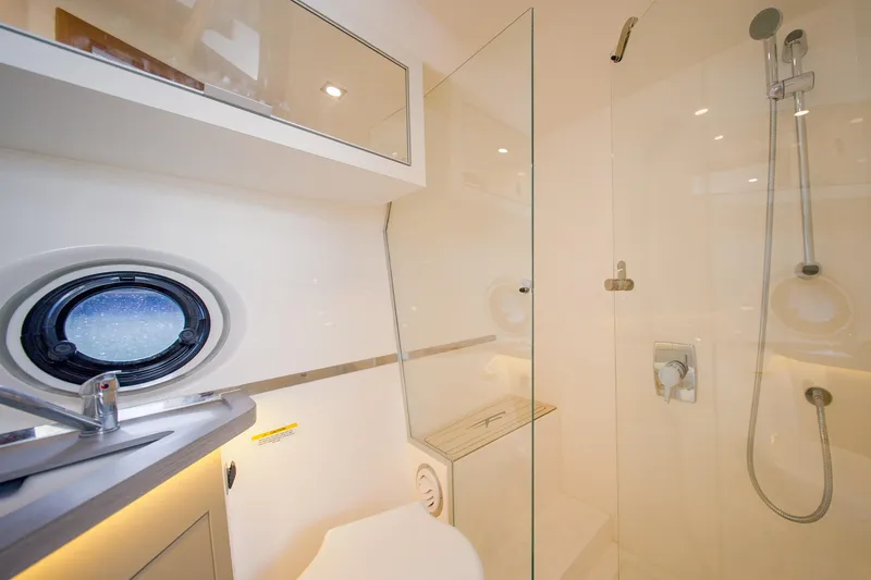 Slide: The Image of Modern bathroom in 2026 Granfort 37 yacht with glass shower and porthole window. - 7
