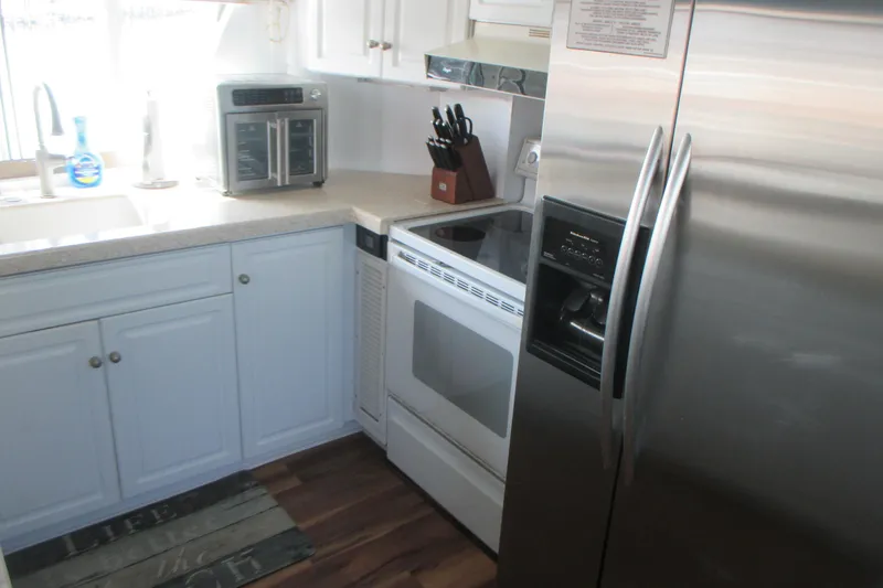 Slide: The Image of Modern kitchen inside 1981 Hatteras 61 Motor Yacht with stainless steel appliances. - 15