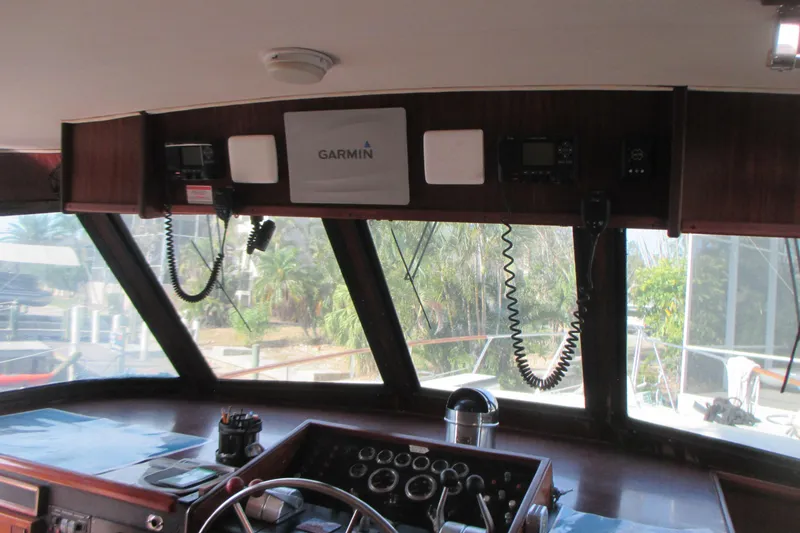 Slide: The Image of Interior helm of 1981 Hatteras 61 Motor Yacht with Garmin navigation equipment. - 22