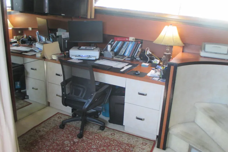 Slide: The Image of 1981 Hatteras 61 Motor Yacht flybridge with seating and helm station. - 25