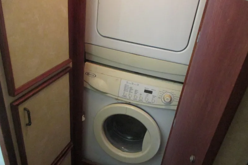 Slide: The Image of 1981 Hatteras 61 Motor Yacht helm with white seating and navigation equipment. - 26