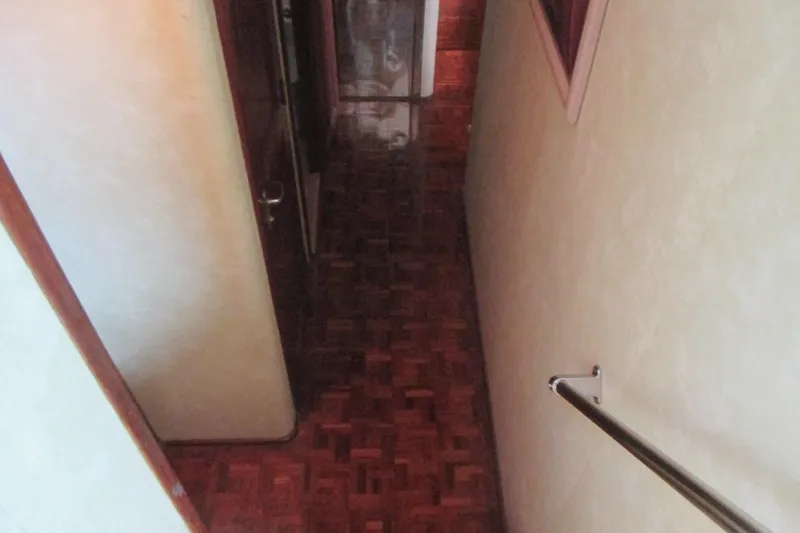 Slide: The Image of Pink kayak on 1981 Hatteras 61 Motor Yacht deck, overlooking calm water. - 31