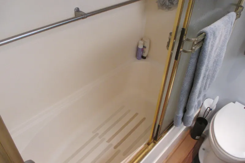 Slide: The Image of Narrow hallway with wooden flooring inside 1981 Hatteras 61 Motor Yacht. - 40