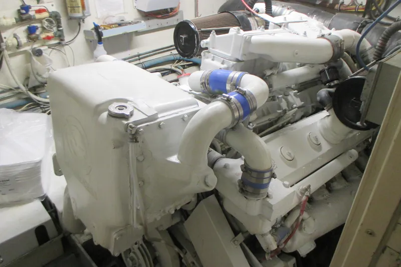 Slide: The Image of Engine room of 1981 Hatteras 61 Motor Yacht, showcasing detailed machinery components. - 50