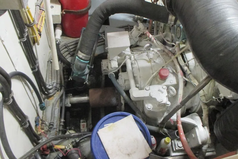 Slide: The Image of Engine room of 1981 Hatteras 61 Motor Yacht with visible machinery and components. - 55