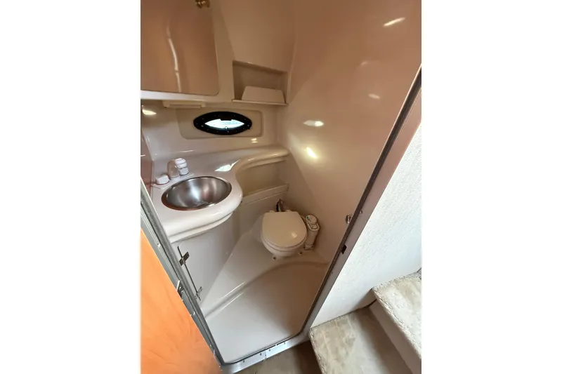 Slide: The Image of Bathroom interior of 2000 Regal Commodore 2760 boat with sink and toilet. - 13