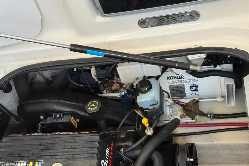 Slide: The Image of Engine compartment of 2000 Regal Commodore 2760 with Kohler power system. - 19