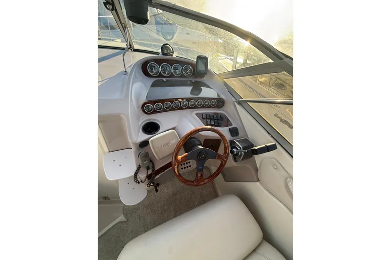 Slide: The Image of 2000 Regal Commodore 2760 boat dashboard with steering wheel and instrument panel. - 5