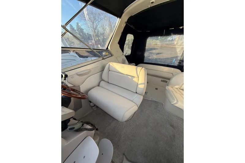 Slide: The Image of Interior of 2000 Regal Commodore 2760 boat with white seating and carpet. - 7