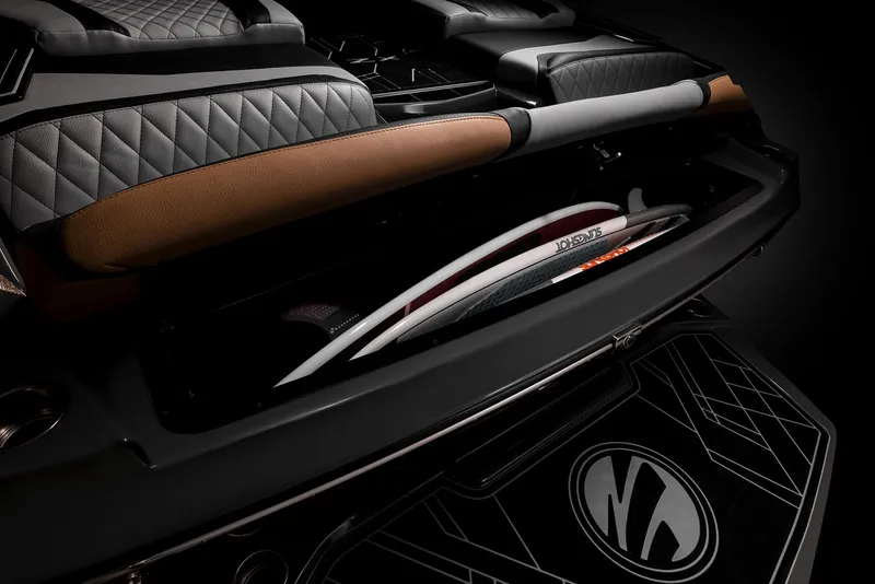 Slide: The Image of 2023 Tigé 23ZX boat rear view with tan seating and swim platform. - 11