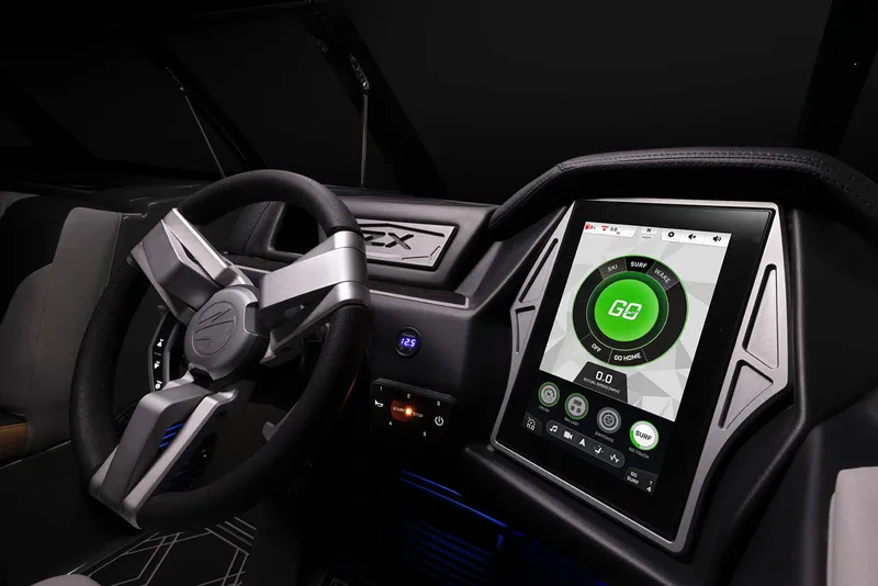 Slide: The Image of 2023 Tigé 23ZX boat, turquoise exterior, close-up view, sleek design. - 13