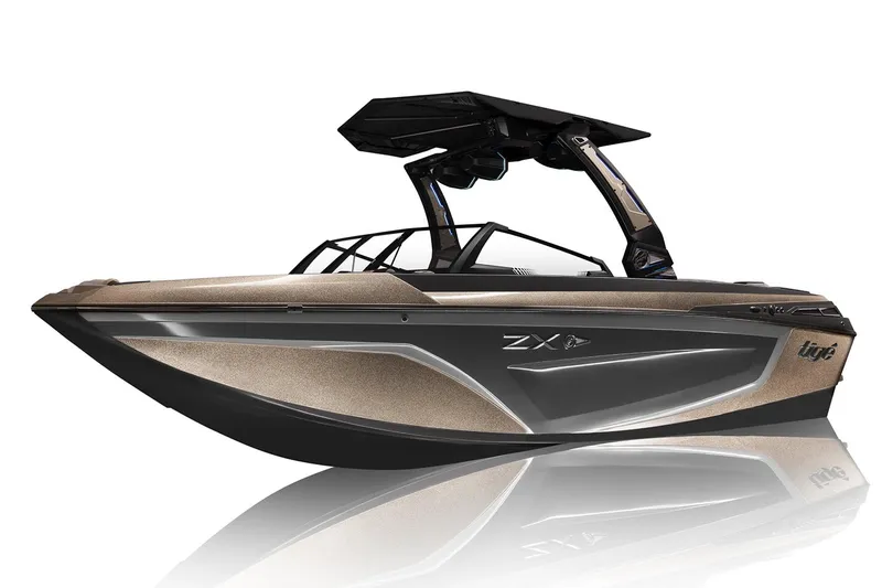 Slide: The Image of 2023 Tigé 23ZX boat with sleek turquoise and black design under a clear blue sky. - 14