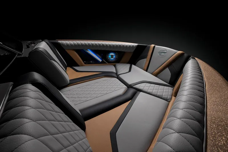 Slide: The Image of 2023 Tigé 23ZX boat in teal and black on a trailer under a clear blue sky. - 4