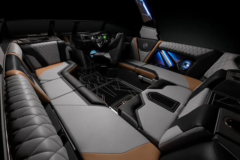 Slide: The Image of 2023 Tigé 23ZX boat with teal and black design, parked under a blue sky. - 5