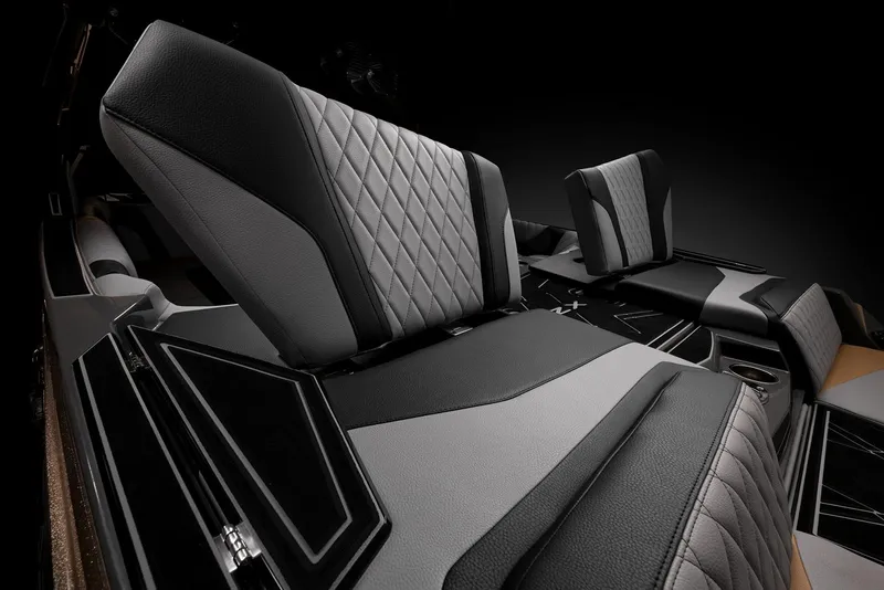 Slide: The Image of 2023 Tigé 23ZX boat in vibrant turquoise on a trailer, side view. - 9