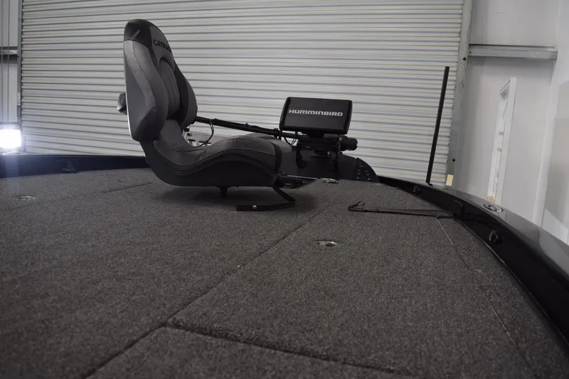 Slide: The Image of 2024 Caymas CX 21 PRO boat interior with Humminbird electronics and seating. - 10