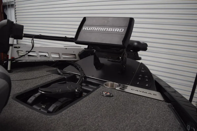 Slide: The Image of 2024 Caymas CX 21 PRO boat dashboard with Humminbird electronics and control panel. - 12