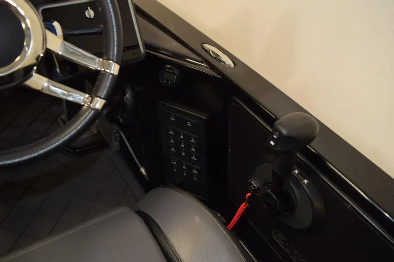 Slide: The Image of 2024 Caymas CX 21 PRO boat interior with steering wheel and control panel. - 15