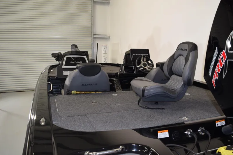 Slide: The Image of 2024 Caymas CX 21 PRO boat interior with seating and control panel. - 6