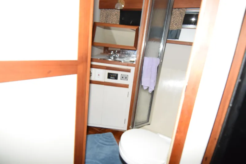 Slide: The Image of 1989 Carver 3297 Mariner bathroom interior with sink, shower, and toilet. - 8
