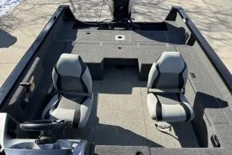 Slide: The Image of 2014 Lowe boat interior with two seats and steering wheel, viewed from above. - 8