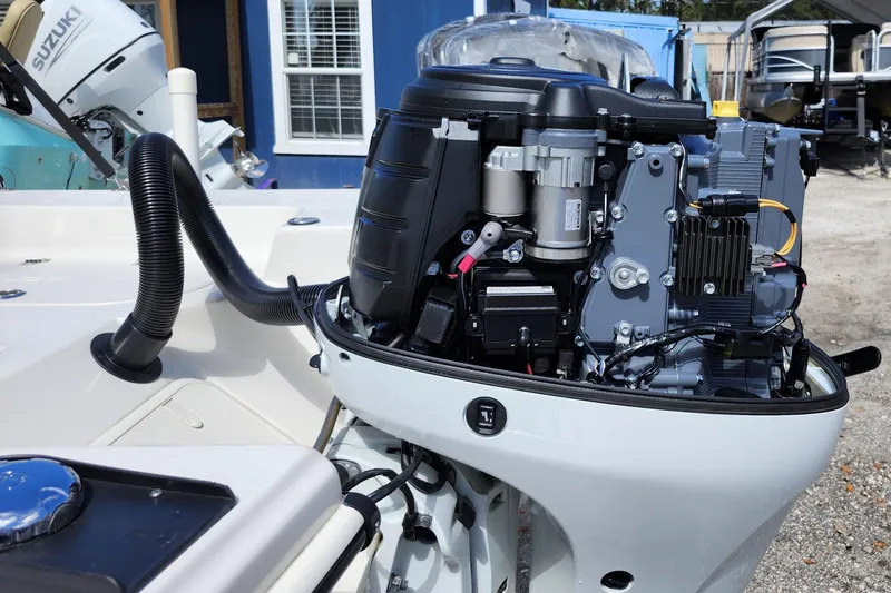 Slide: The Image of 2022 Carolina Skiff 178 JLS boat engine close-up, showcasing detailed components. - 10