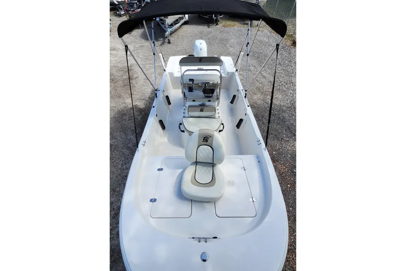 Slide: The Image of 2022 Carolina Skiff 178 JLS boat with seating and canopy, viewed from above. - 13