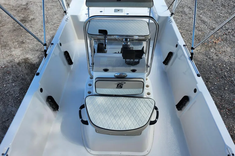 Slide: The Image of 2022 Carolina Skiff 178 JLS boat interior with seating and console. - 14