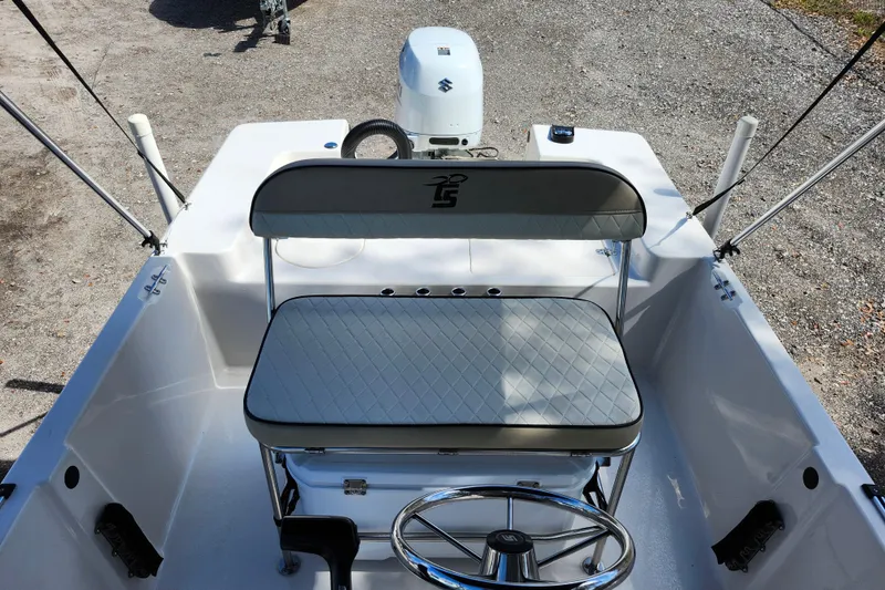 Slide: The Image of 2022 Carolina Skiff 178 JLS boat interior with steering wheel and seating. - 18