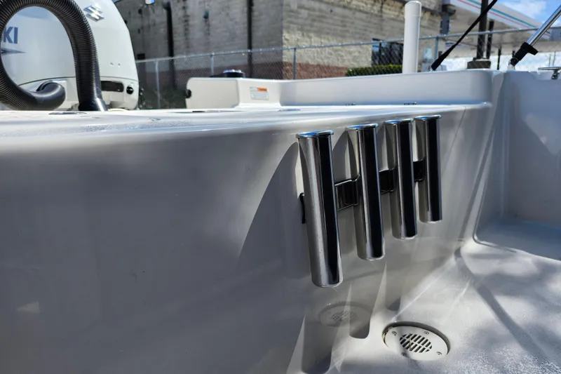 Slide: The Image of 2022 Carolina Skiff 178 JLS boat with rod holders and Suzuki engine. - 23