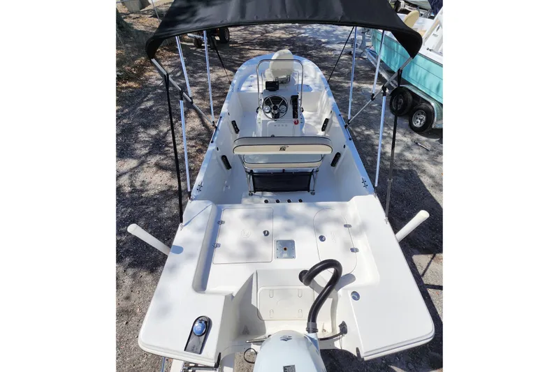 Slide: The Image of 2022 Carolina Skiff 178 JLS boat interior with steering console and seating. - 27