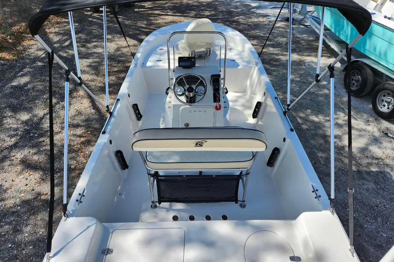 Slide: The Image of 2022 Carolina Skiff 178 JLS boat interior with steering console and seating. - 29