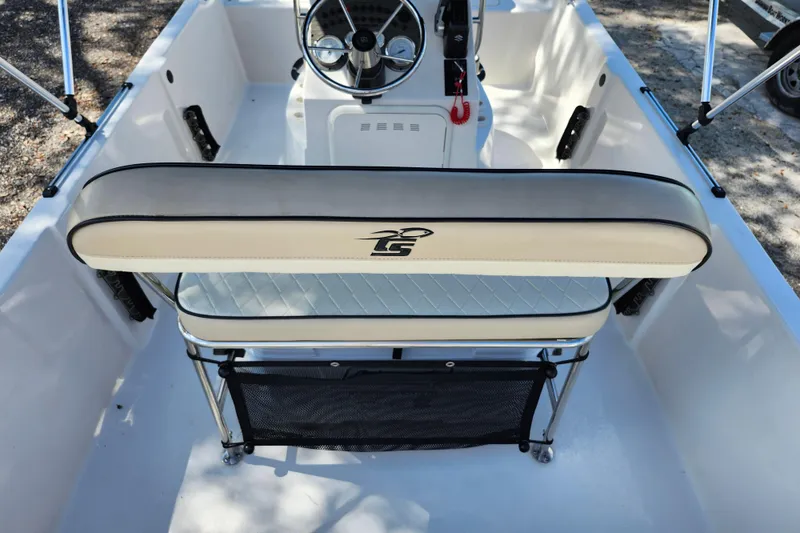 Slide: The Image of 2022 Carolina Skiff 178 JLS boat interior with steering console and cushioned seating. - 31