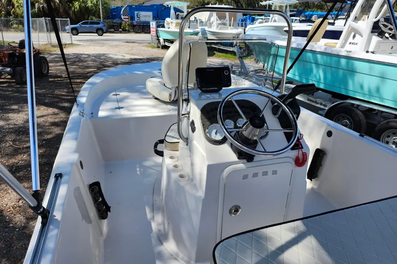 Slide: The Image of 2022 Carolina Skiff 178 JLS boat interior with steering console and seating. - 32