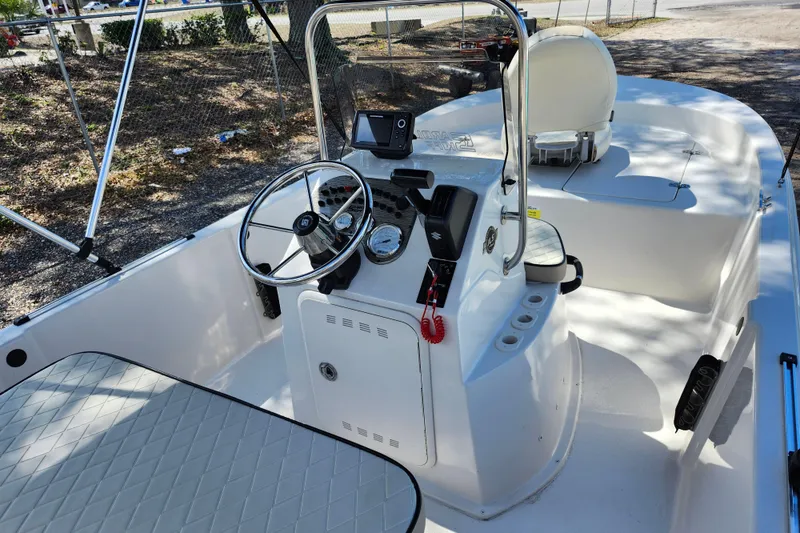 Slide: The Image of 2022 Carolina Skiff 178 JLS boat interior with steering console and seating. - 33