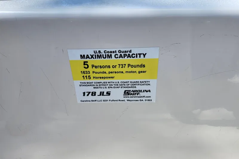 Slide: The Image of 2022 Carolina Skiff 178 JLS capacity label: 5 persons, 737 pounds, 115 horsepower. - 35