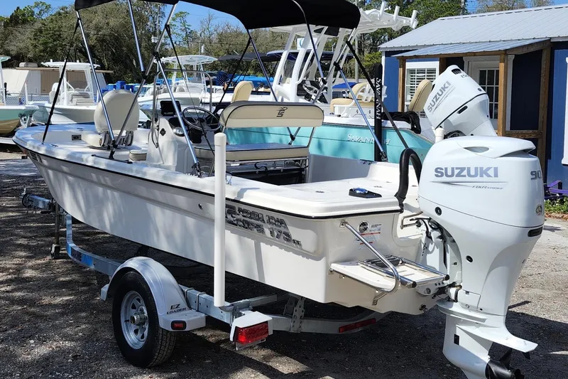 Slide: The Image of 2022 Carolina Skiff 178 JLS boat with Suzuki outboard motor on trailer. - 4