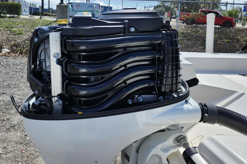 Slide: The Image of 2022 Carolina Skiff 178 JLS boat engine close-up, showcasing intricate mechanical details. - 8